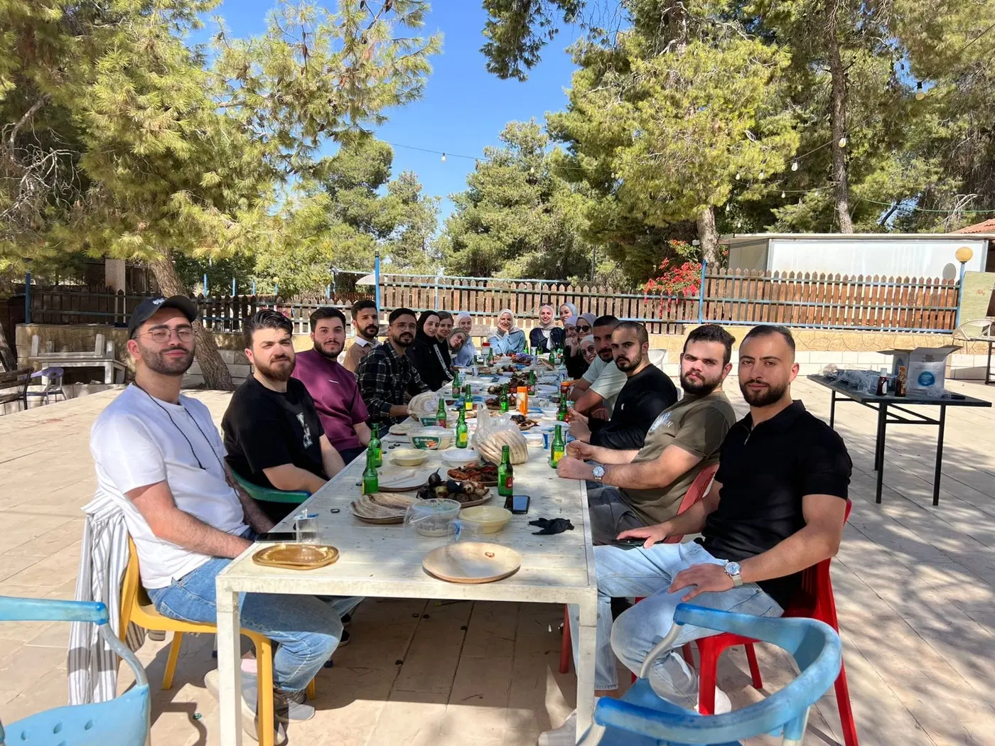 The team sharing a meal outdoors